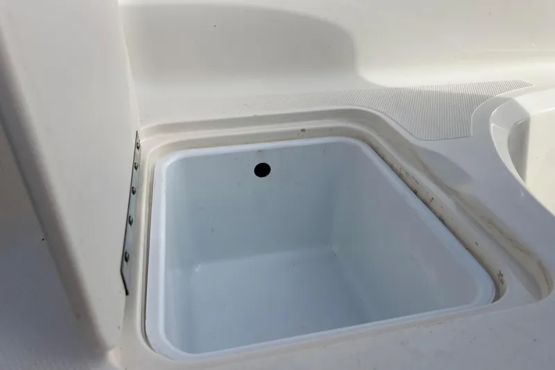Slide: The Image of Open storage compartment on 2006 Hurricane FunDeck GS 194 OB boat. - 18