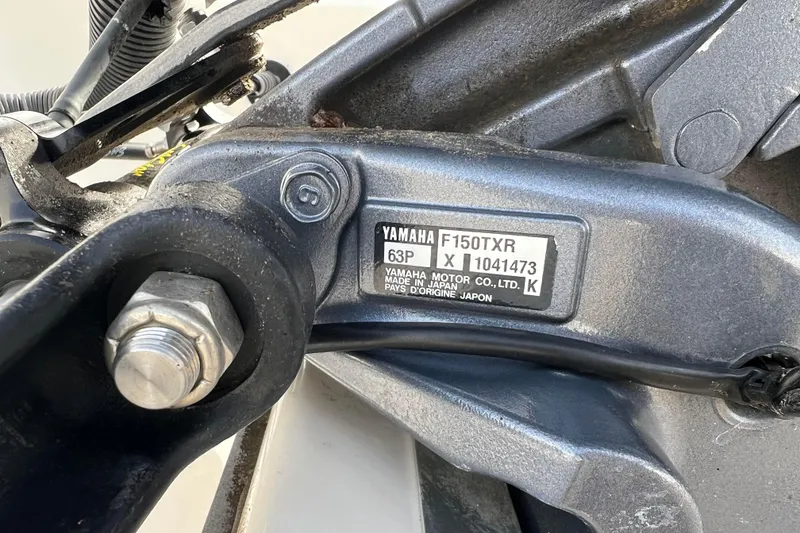 Slide: The Image of Close-up of Yamaha F150TXR engine part on 2006 Hurricane FunDeck GS 194 OB. - 19