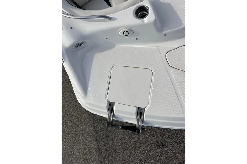 Slide: The Image of 2006 Hurricane FunDeck GS 194 OB boat deck with ladder and cup holder. - 29