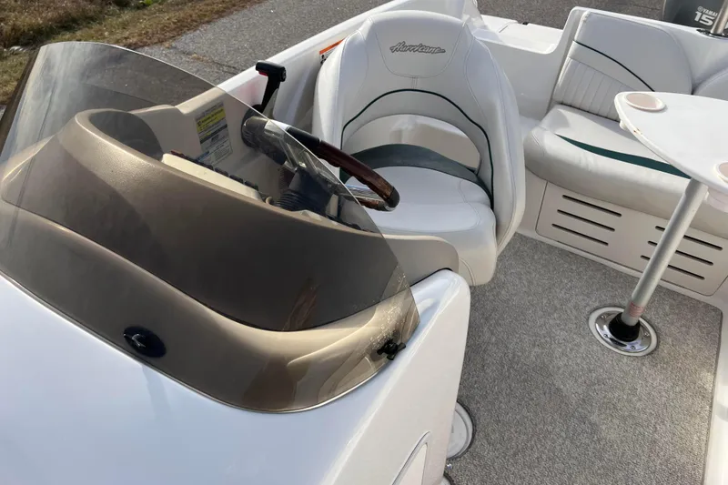Slide: The Image of 2006 Hurricane FunDeck GS 194 OB boat interior with steering wheel and seating area. - 35