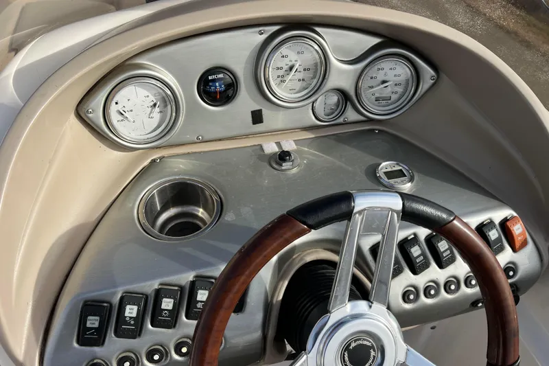 Slide: The Image of Dashboard of 2006 Hurricane FunDeck GS 194 OB boat with gauges and controls. - 38
