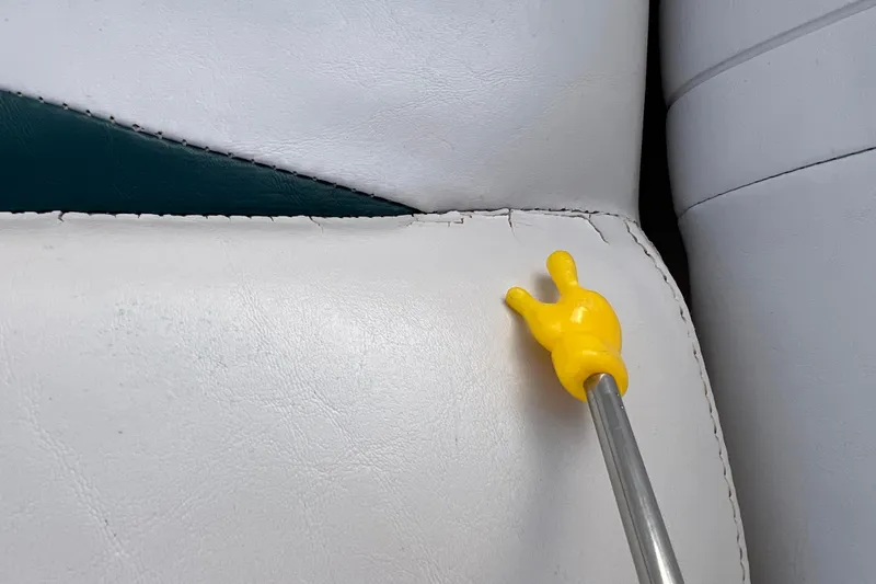 Slide: The Image of Close-up of 2006 Hurricane FunDeck GS 194 OB seat with visible seam damage. - 45