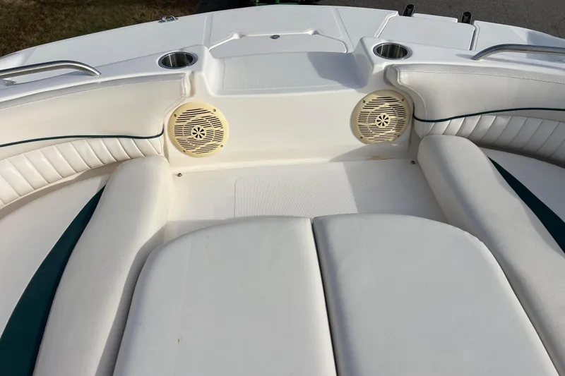 Slide: The Image of 2006 Hurricane FunDeck GS 194 OB boat interior with white seating and built-in speakers. - 49