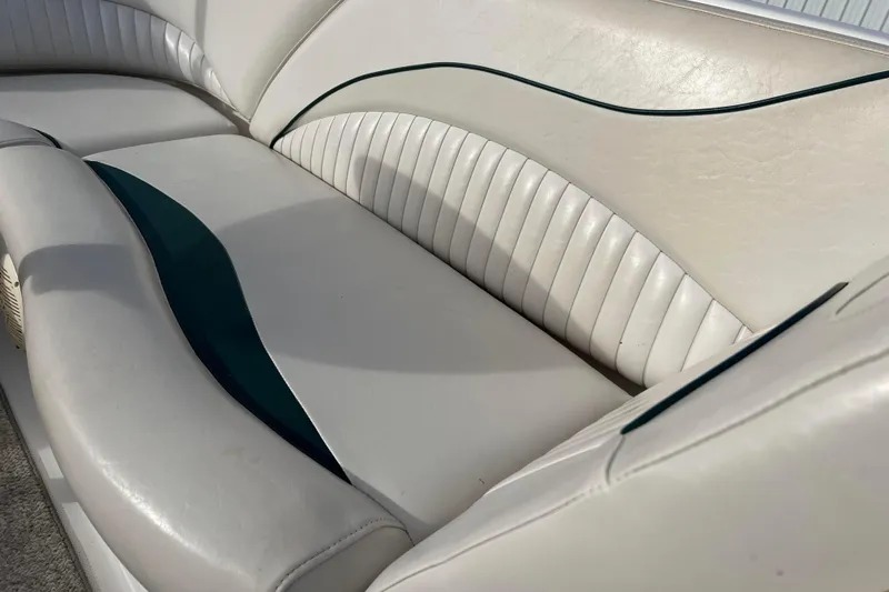 Slide: The Image of 2006 Hurricane FunDeck GS 194 OB boat interior with white and teal seating. - 50