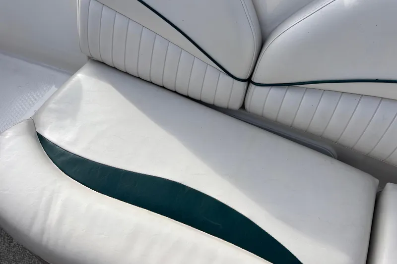 Slide: The Image of White and teal seating on 2006 Hurricane FunDeck GS 194 OB boat. - 52