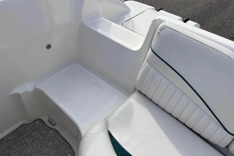 Slide: The Image of 2006 Hurricane FunDeck GS 194 OB boat interior with white seating and textured flooring. - 53
