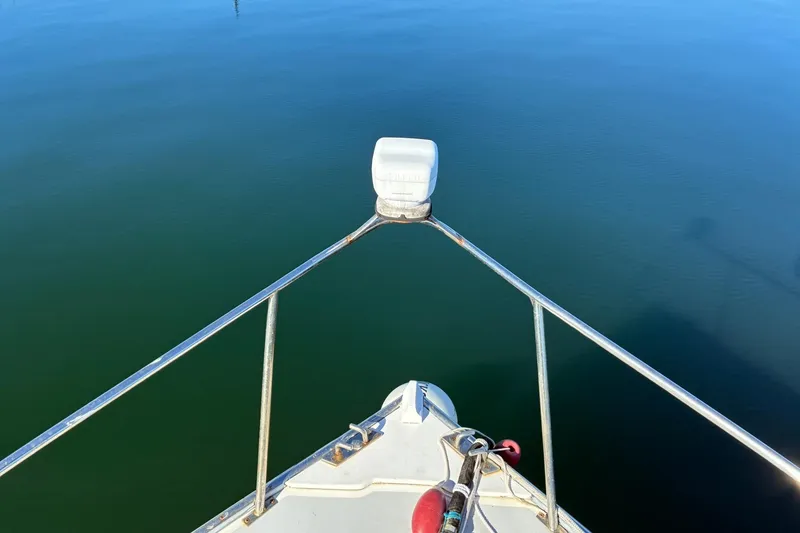 Slide: The Image of Bow of 2000 Calvin Beal COI PASSENGER boat on calm water. - 12