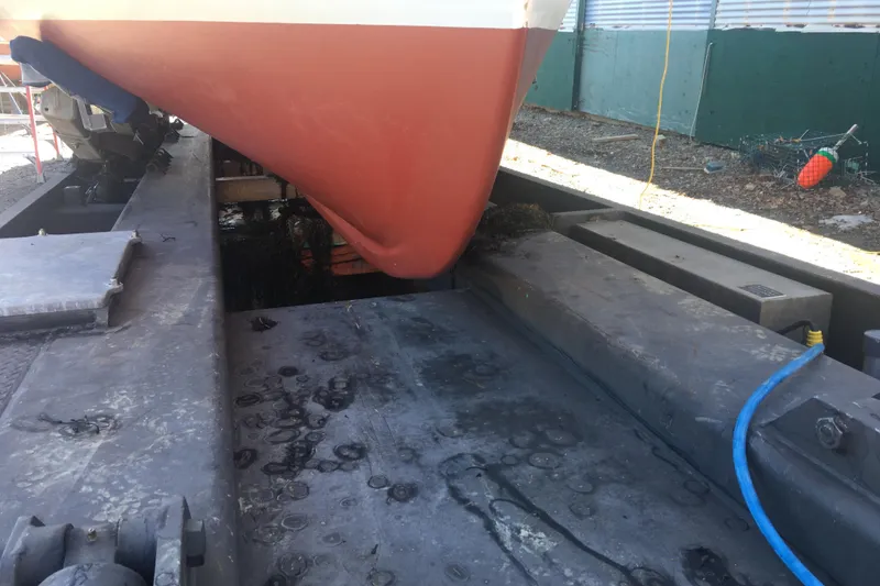 Slide: The Image of Calvin Beal COI PASSENGER 2000 boat hull on dry dock with maintenance equipment. - 14