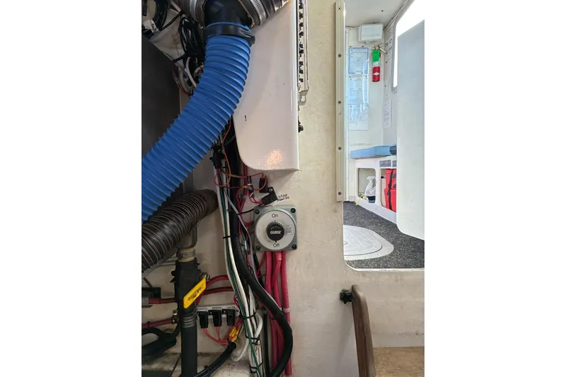 Slide: The Image of Interior view of a 2000 Calvin Beal COI Passenger boat, showing wiring and ventilation. - 17