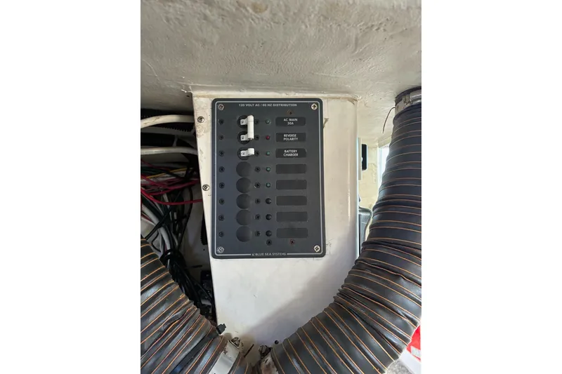Slide: The Image of Electrical panel on a 2000 Calvin Beal COI PASSENGER boat, featuring Blue Sea Systems components. - 22