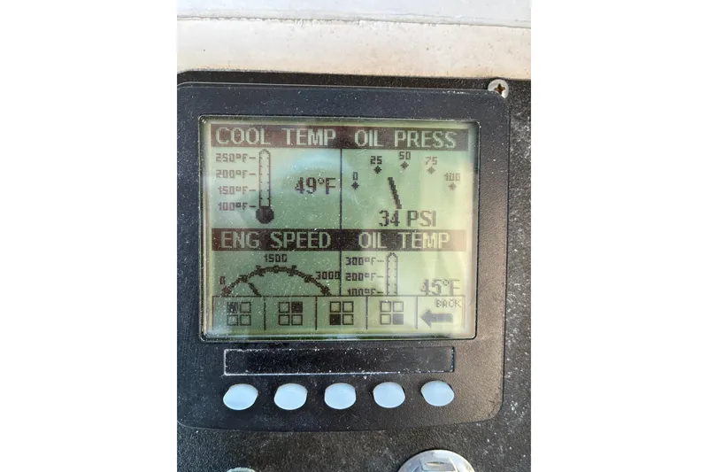 Slide: The Image of Dashboard display showing engine temperature and oil pressure on a 2000 Calvin Beal COI Passenger. - 26