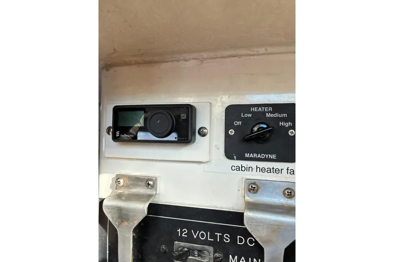 Slide: The Image of Control panel of a 2000 Calvin Beal COI PASSENGER boat with heater settings. - 28