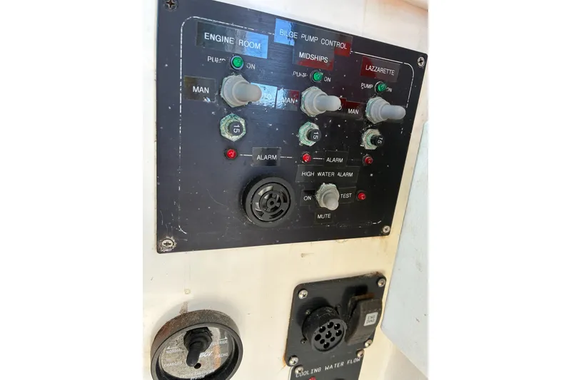 Slide: The Image of Control panel of a 2000 Calvin Beal COI PASSENGER boat, featuring bilge pump controls. - 32