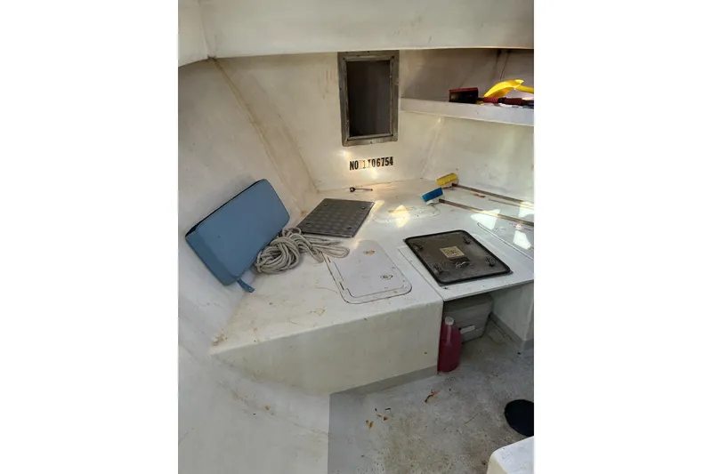 Slide: The Image of Interior of 2000 Calvin Beal COI PASSENGER boat with storage compartments and equipment. - 37