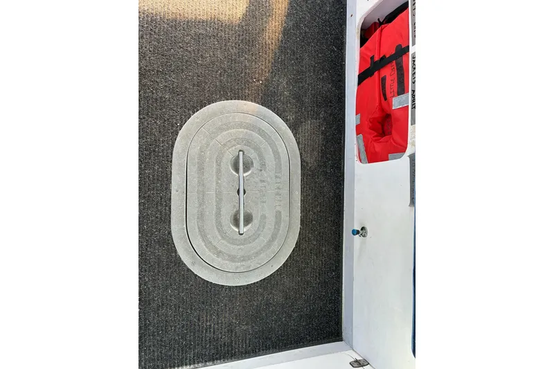 Slide: The Image of Calvin Beal COI PASSENGER 2000 boat interior with hatch and life jackets. - 40