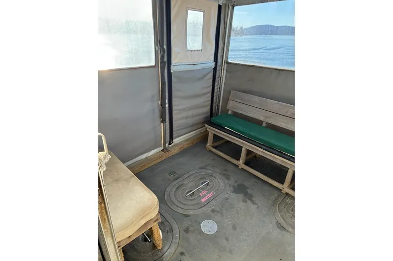 Slide: The Image of Interior of a 2000 Calvin Beal COI PASSENGER boat with seating and windows. - 41