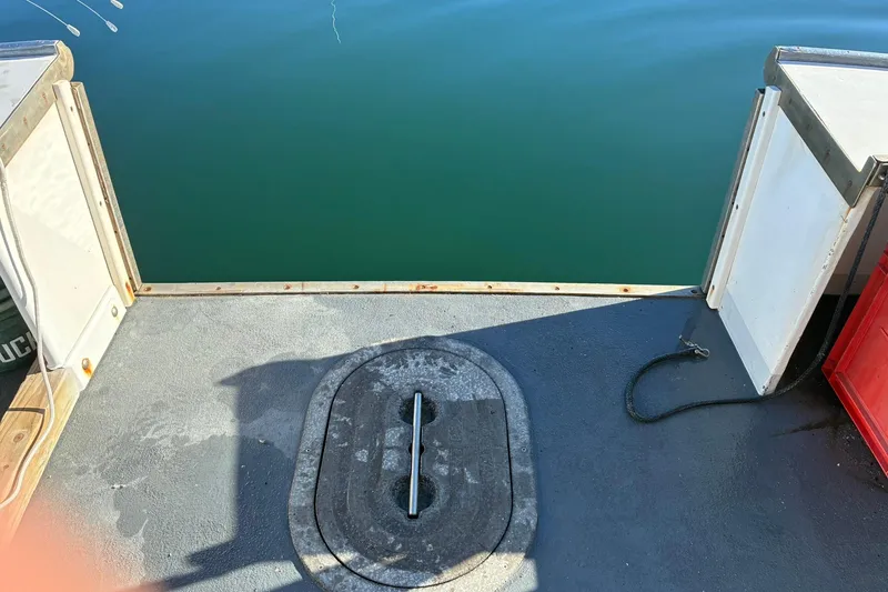 Slide: The Image of Open deck of 2000 Calvin Beal COI PASSENGER boat with water view. - 43