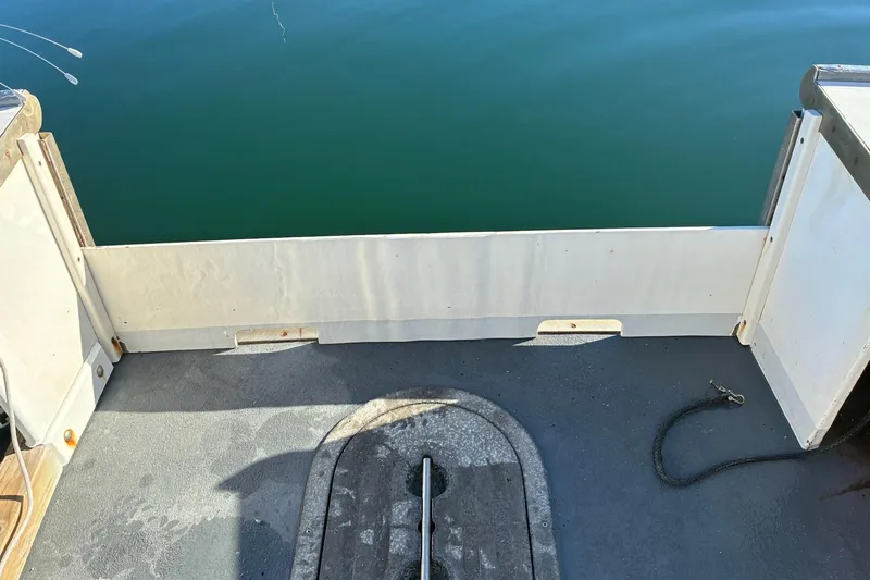 Slide: The Image of Calvin Beal COI PASSENGER boat deck, 2000 model, overlooking calm water. - 44