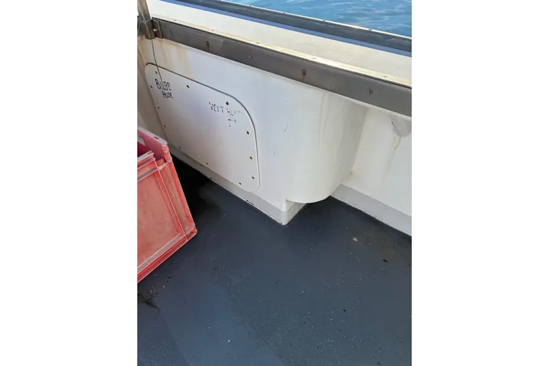 Slide: The Image of Interior view of a 2000 Calvin Beal COI PASSENGER boat, showing bilge hose area. - 46