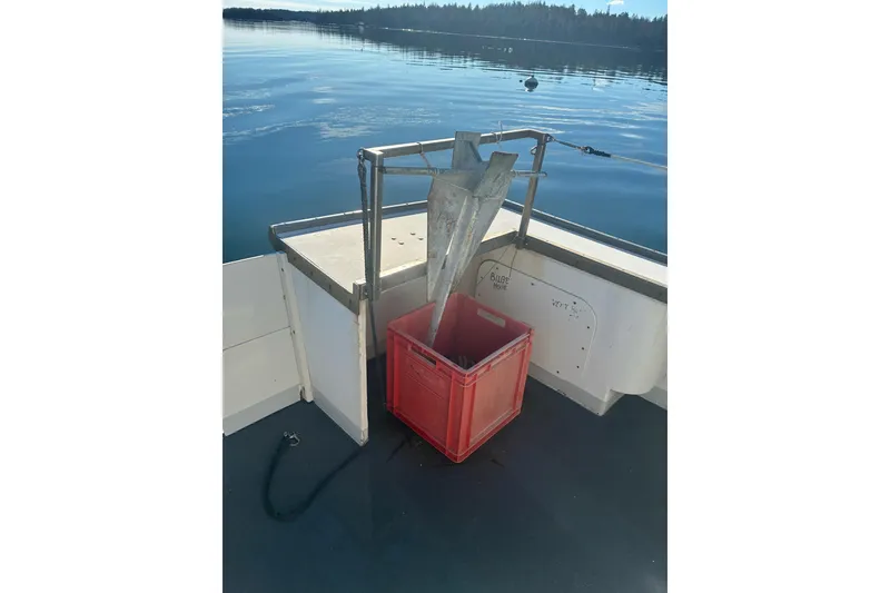 Slide: The Image of Calvin Beal COI PASSENGER boat deck with anchor and red crate, 2000 model. - 47