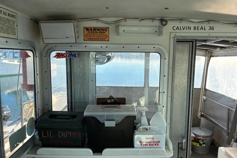 Slide: The Image of Interior of a 2000 Calvin Beal COI Passenger boat with safety equipment. - 54