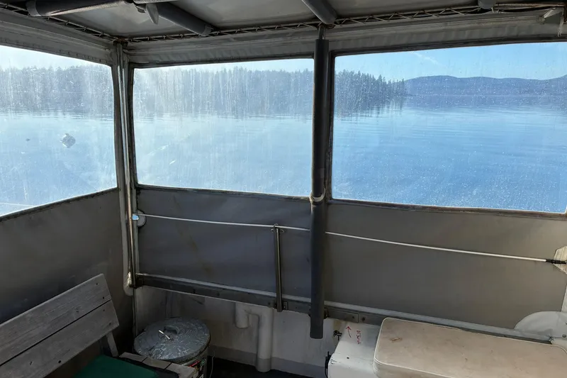 Slide: The Image of Interior view of a 2000 Calvin Beal COI PASSENGER boat with lake scenery. - 55
