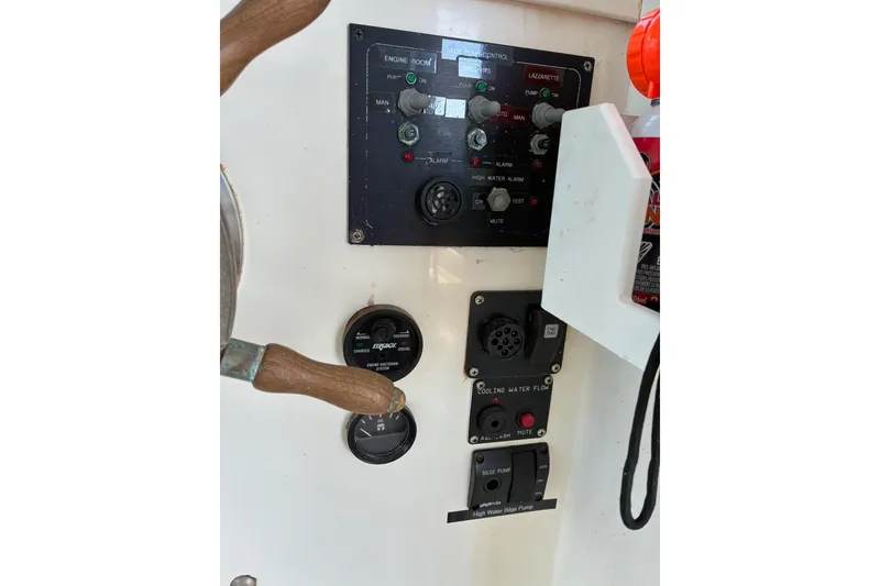Slide: The Image of Control panel of a 2000 Calvin Beal COI PASSENGER boat with gauges and switches. - 59