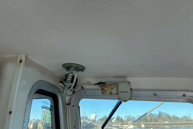 Slide: The Image of Interior view of a 2000 Calvin Beal COI PASSENGER boat, showing window and ceiling details. - 60
