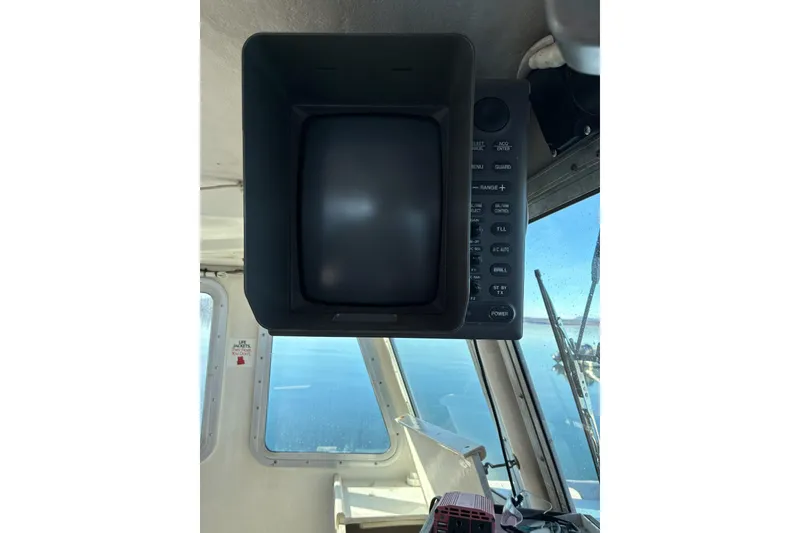 Slide: The Image of Calvin Beal COI Passenger 2000 boat interior with navigation equipment and sea view. - 69