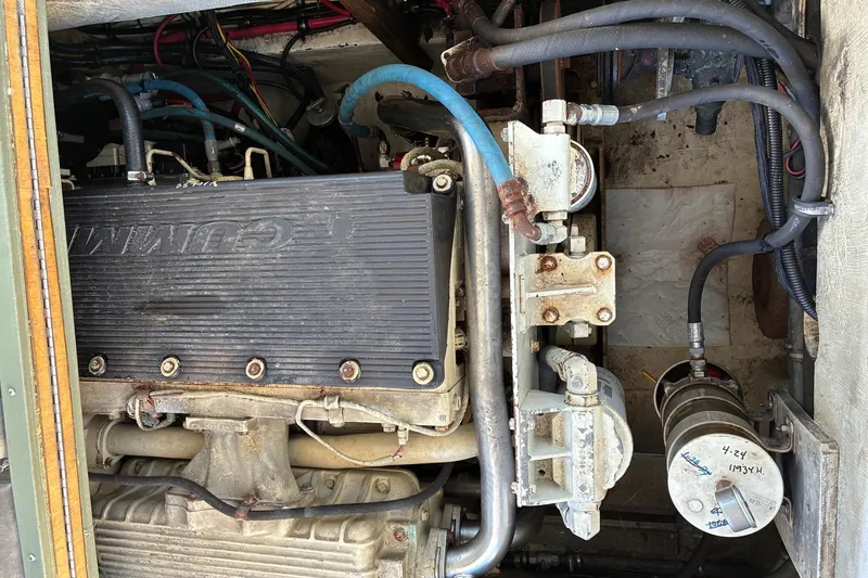 Slide: The Image of Engine compartment of a 2000 Calvin Beal COI PASSENGER boat, featuring Cummins components. - 71