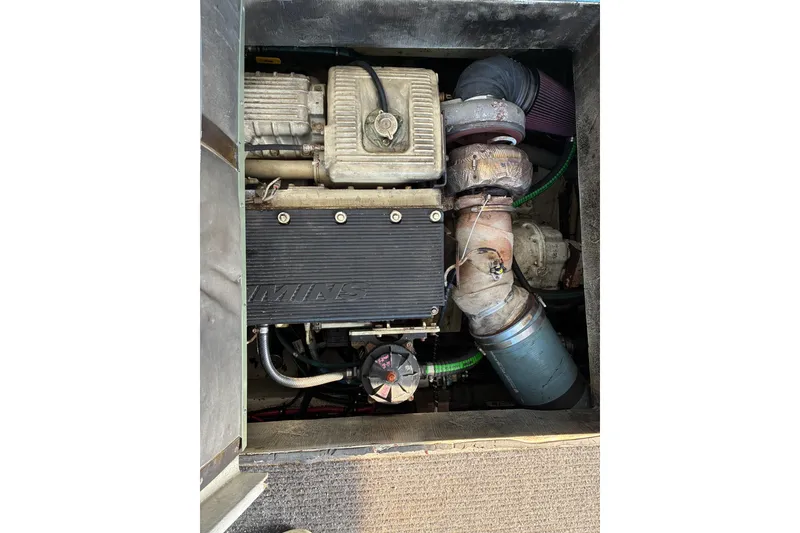 Slide: The Image of Engine compartment of a 2000 Calvin Beal COI PASSENGER boat, featuring Cummins components. - 72