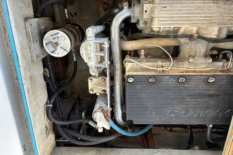 Slide: The Image of Engine compartment of a 2000 Calvin Beal COI PASSENGER boat, showing mechanical components. - 74