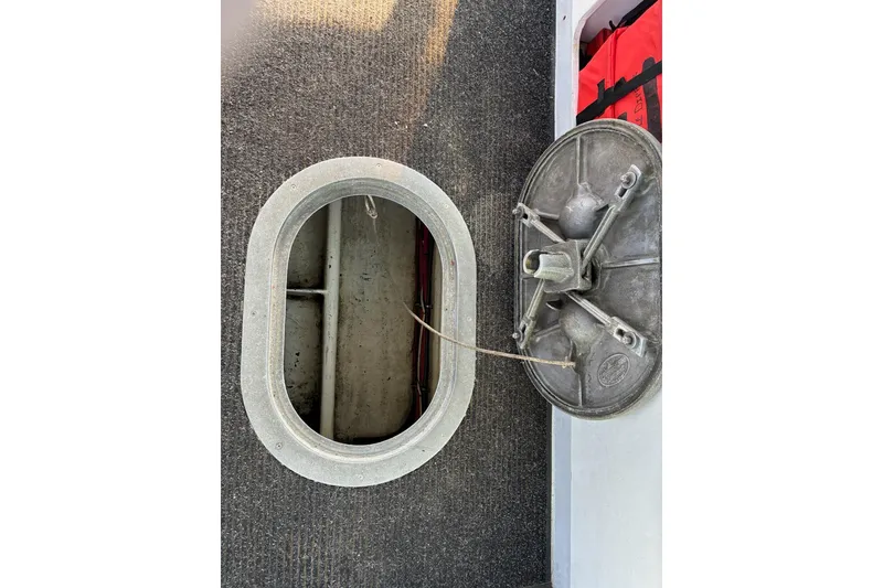 Slide: The Image of Open hatch on 2000 Calvin Beal COI PASSENGER boat, showing interior compartment. - 77