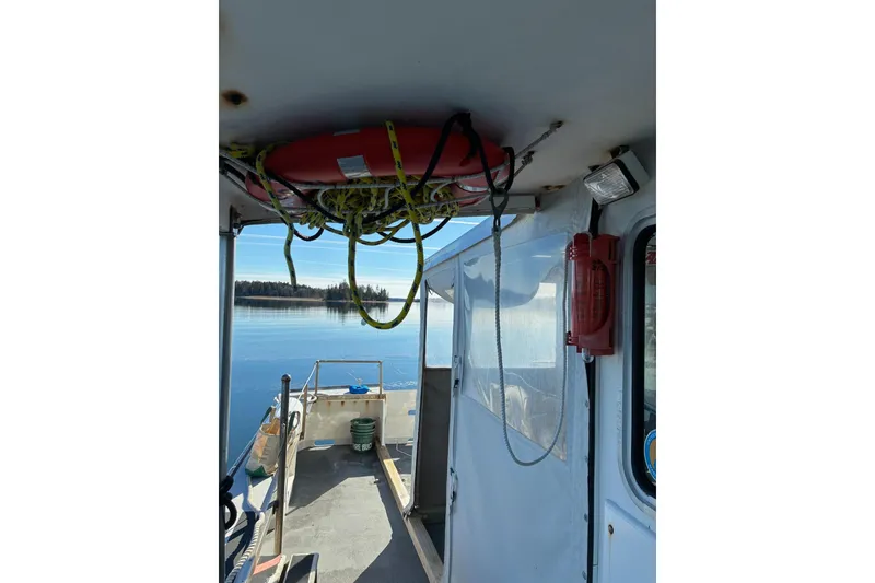 Slide: The Image of Interior view of a 2000 Calvin Beal COI Passenger boat with safety equipment. - 9