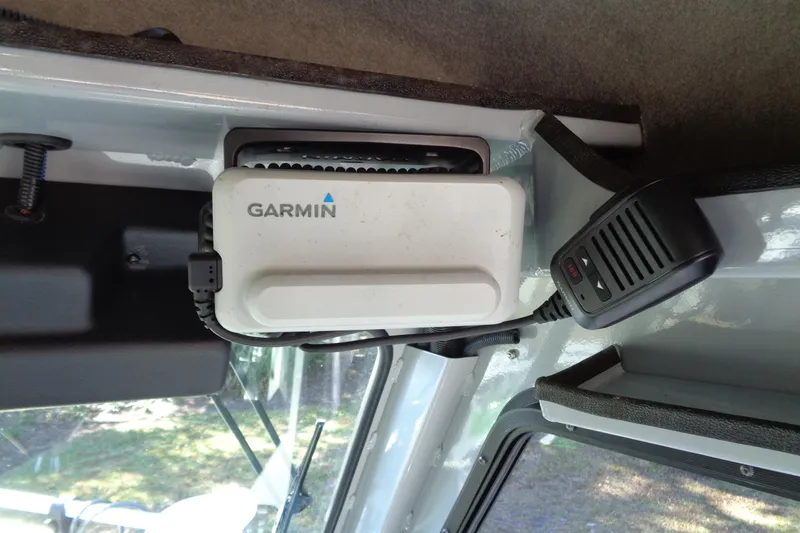 Slide: The Image of Garmin device and microphone in 2022 Hewes 210 Searunner ET Hartop boat interior. - 15