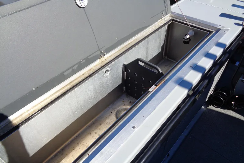 Slide: The Image of 2022 Hewes 210 Searunner ET Hartop boat storage compartment, open and empty. - 29