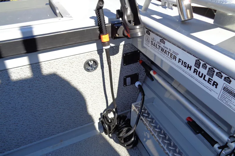 Slide: The Image of 2022 Hewes 210 Searunner ET Hardtop interior with saltwater fish ruler and equipment. - 32