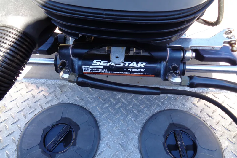 Slide: The Image of Close-up of SeaStar hydraulic steering system on 2022 Hewes 210 Searunner ET Hardtop. - 34