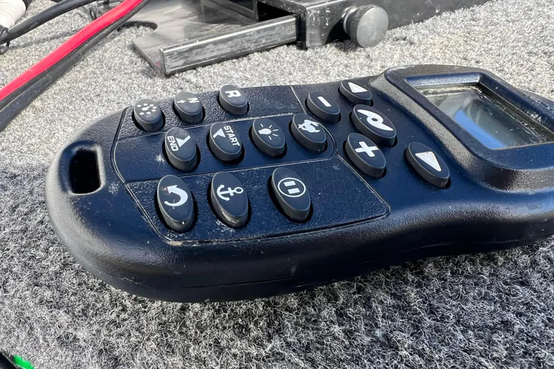 Slide: The Image of Close-up of 2023 Lund SSV-14 Tiller's i-Pilot GPS trolling system control. - 18