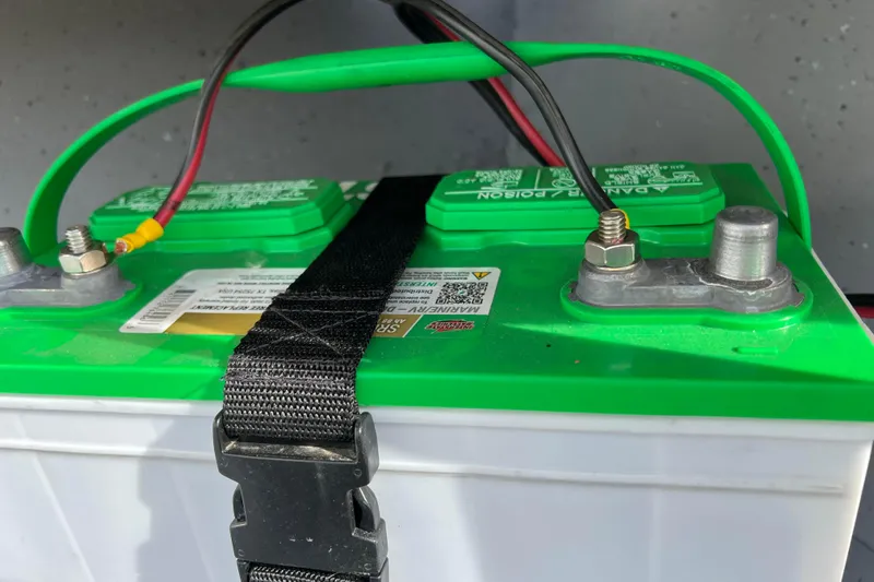 Slide: The Image of Remote control on Lund SSV-14 Tiller boat, 2023 model, with various function buttons. - 19