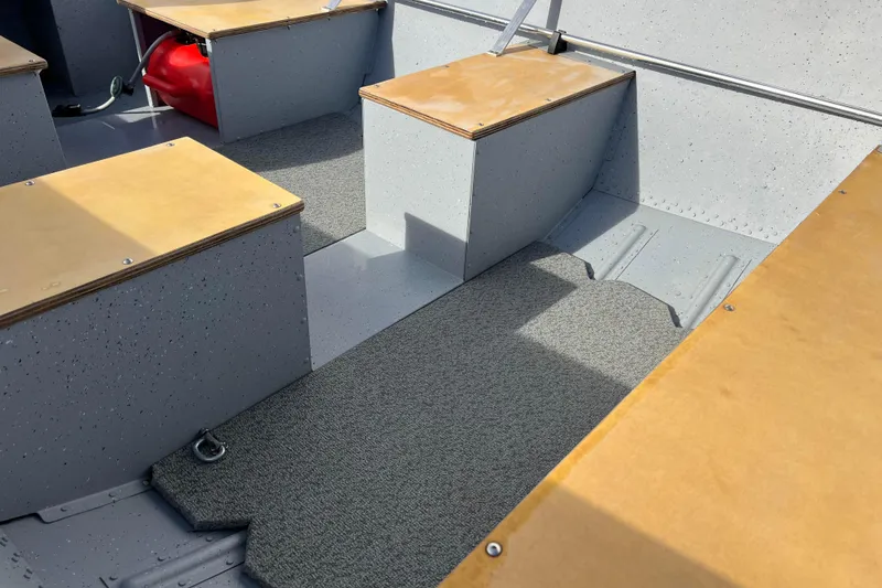 Slide: The Image of Battery in a 2023 Lund SSV-14 Tiller boat, secured with a black strap. - 20