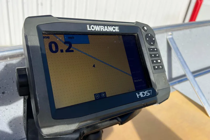 Slide: The Image of 2023 Lund SSV-14 Tiller boat control handle with gear settings and cables. - 24