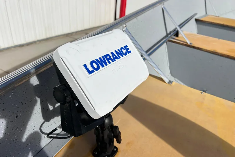 Slide: The Image of Lowrance HDS7 fishfinder on 2023 Lund SSV-14 Tiller boat, displaying navigation data. - 25