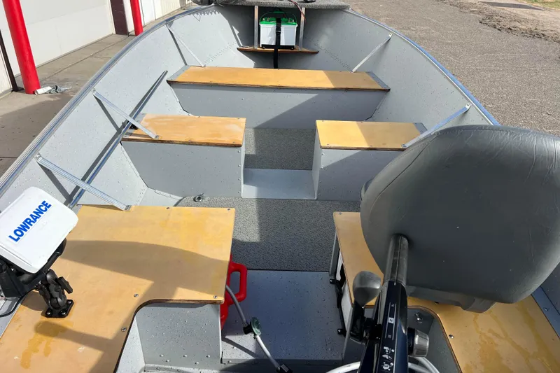 Slide: The Image of Close-up of 2023 Lund SSV-14 Tiller control switch with "UP" and "DN" buttons. - 29