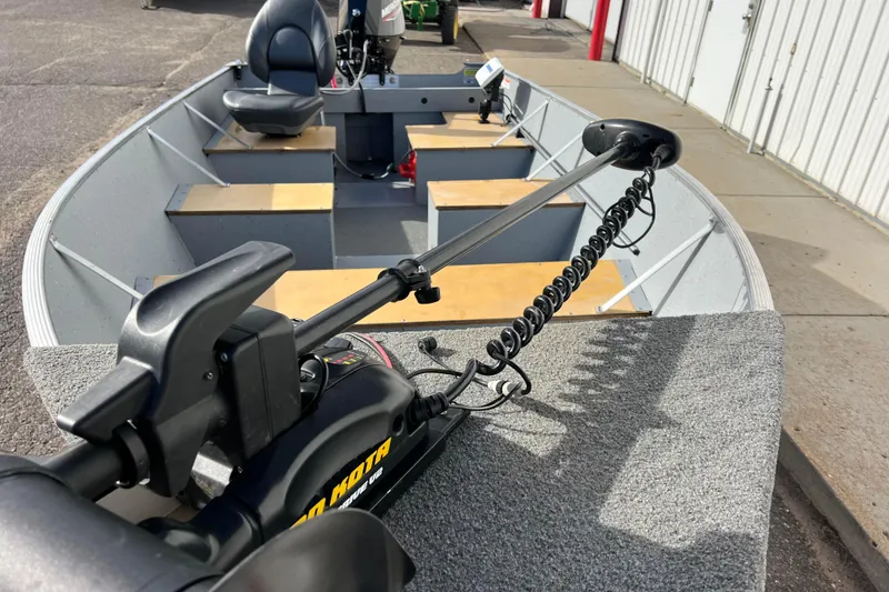 Slide: The Image of 2023 Lund SSV-14 Tiller boat interior with seating and Lowrance equipment. - 30