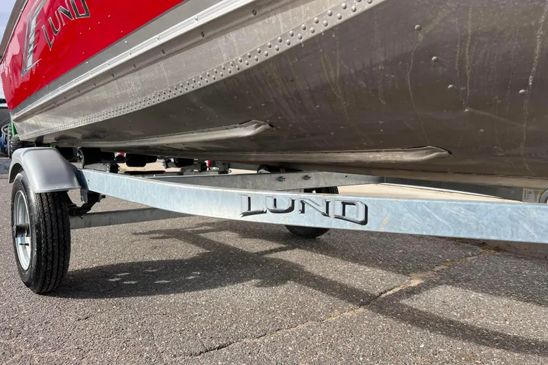 Slide: The Image of 2023 Lund SSV-14 Tiller boat interior with steering controls and seating. - 34