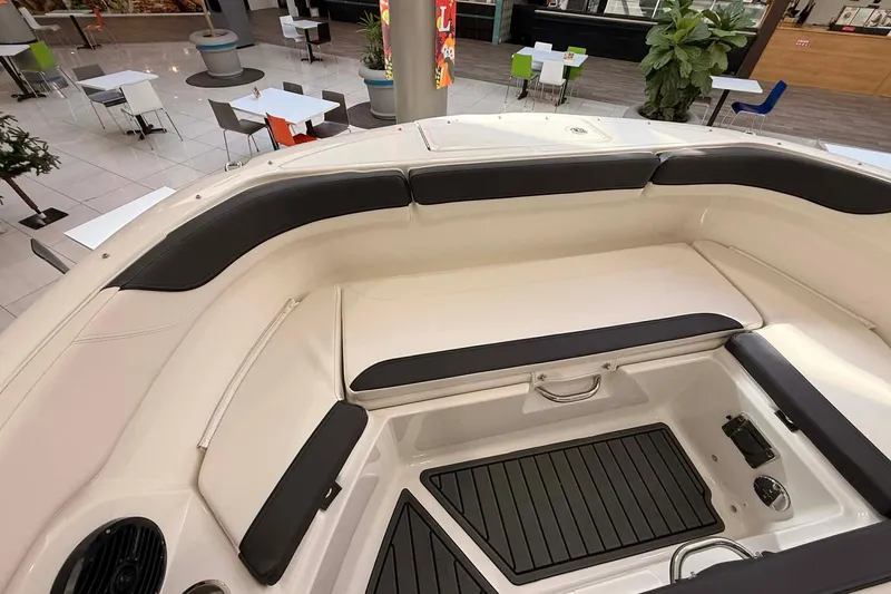 Slide: The Image of 2026 Bayliner Trophy T22SC boat interior with cushioned seating and sleek design. - 11