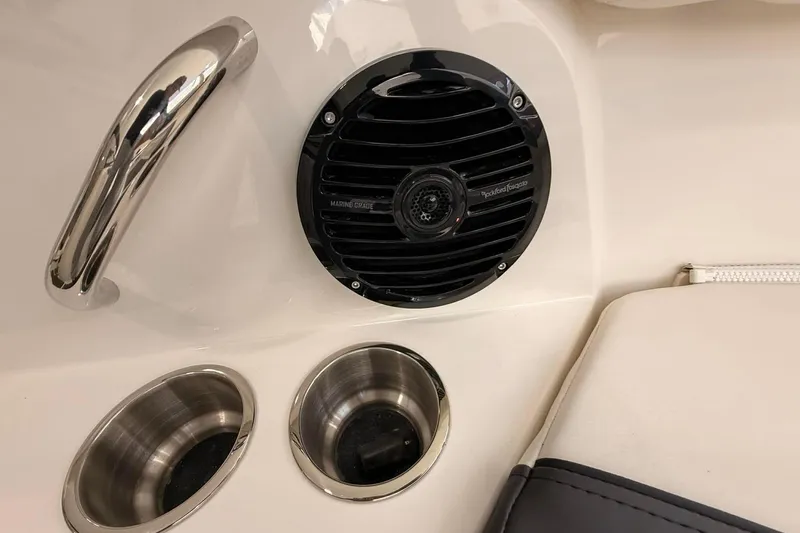 Slide: The Image of 2026 Bayliner Trophy T22SC boat interior with speaker and cup holders. - 14