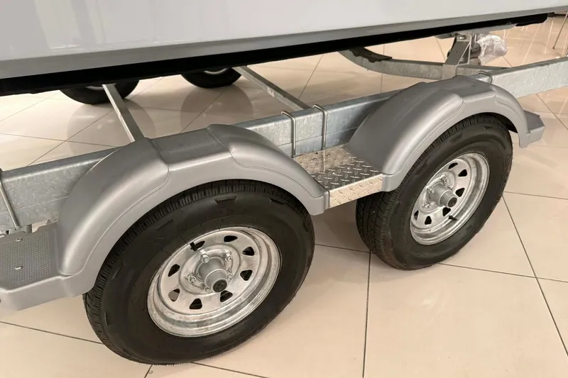 Slide: The Image of Trailer wheels for 2026 Bayliner Trophy T22SC boat, displayed indoors. - 17
