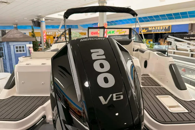 Slide: The Image of 2026 Bayliner Trophy T22SC with Mercury 200 V6 engine in showroom display. - 18